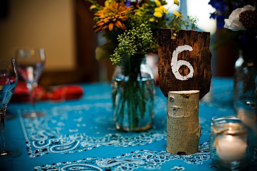 Rustic table numbers helped guests find their seats.