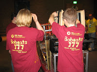 Students fixing the robot