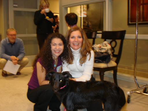 Kiara winks at the camera as Martha sips coffee and gets acquainted with all the dogs in the green room.