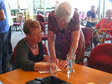 Committee Members, Diane Lyons and Delyse Whorwood keeping abreast of the dinner schedule. Photo courtesy of Dennis Lyons