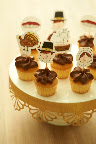 These cupcakes are decorated with my Thanksgiving artwork. Download them here: http://www.marthastewart.com/951490/darcy-millers-thanksgiving-ideas, then simply cut them out and tape them to toothpicks. These cupcakes are decorated with my Thanksgiving artwork. Download them here: http://www.marthastewart.com/951490/darcy-millers-thanksgiving-ideas, then simply cut them out and tape them to toothpicks.
