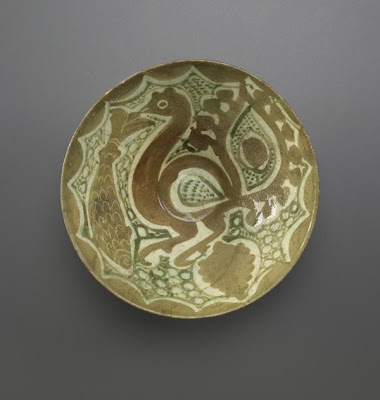 Deep bowl | Origin:  Iran | Period: 10th-11th century | Details:  Not Available | Type: Earthenware painted with slip under transparent glaze | Size: H: 7.6  W: 18.5  cm | Museum Code: F1966.27 | Photograph and description taken from Freer and the Sackler (Smithsonian) Museums.
