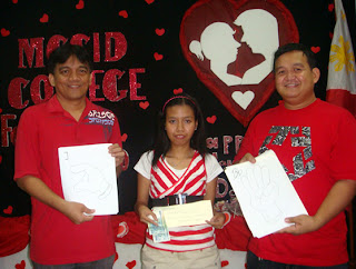 Sir Jojo presents P2,000 cash prize to Jennyfer Cahilig for winning the MCCID FSL Design Font Contest.