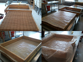 Our deckle-box set up:  a bamboo screen for the mould; a pelon (which the pulp fibers drain through/sit on); the deckle being latched on top; the plastic, to keep the pulp from draining out until we're ready!