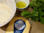 Ingredients for the pizza-from left to right-chickpea flour mixture with rosemary, olive oil, broccoli rabe, and aged gouda cheese