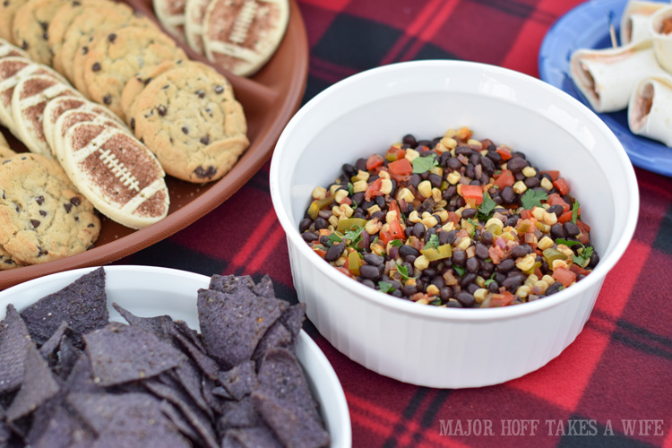 Black bean and corn salsa for a fun tex mex tailgating party. Need a quick recipe for your next tailgate? Look no further than already prepared Deli Hot wings by Tyson. Make quick hot wing tortilla roll ups if you are in a hurry, or take the time to make Tex Mex Hot Wing Enchiladas. Great for a last minute dinner too! #GameTimeHero #CollectiveBias #recipe #ad Black bean and corn salsa for a fun tex mex tailgating party