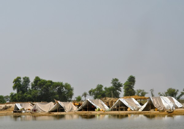 Tents erected next to floodwaters in a Pakistan refugee camp, September 2011. globalmedic.ca