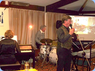 The Music Makers Band in full swing. Left to Right: Carole Littlejohn, Ian Jackson, Len Hancy, and Peter Brophy (partially obscured).