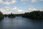 A cottage in the middle of a lake