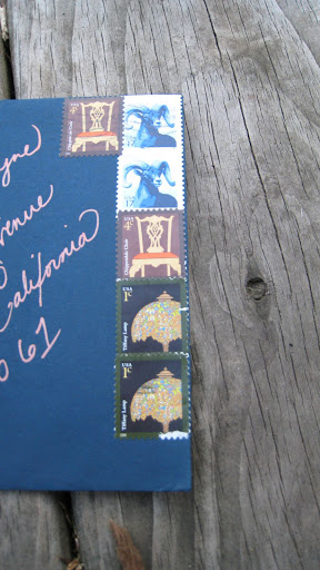 A collection of postage stamps and Melissa's handwritten addresses decked the fronts of the envelopes. A collection of postage stamps and Melissa's handwritten addresses decked the fronts of the envelopes.