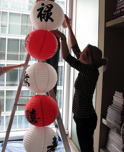 Decorating Editor Rebecca Robertson helped connect the left-over lanterns. Our idea is to stack the remaining paper lanterns in the corner of the library. Decorating Editor Rebecca Robertson helped connect the left-over lanterns. Our idea is to stack the remaining paper lanterns in the corner of the library.