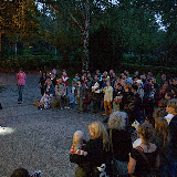 Roberti guides the people in the dark graveyard with his lamp Roberti guides the people in the dark graveyard with his lamp