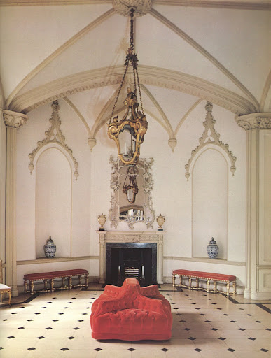 The gothic entrance hall of the Luttrellstown Castle, Dublin, includes a most interesting French tufted red velvet chair simply set in the center of the room. The gothic entrance hall of the Luttrellstown Castle, Dublin, includes a most interesting French tufted red velvet chair simply set in the center of the room.