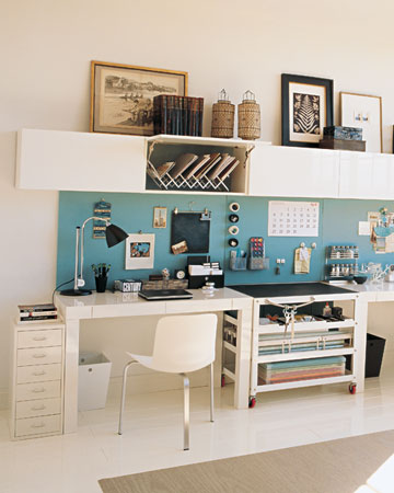 It can be a challenge to create a desk that's roomy enough for one person, let alone two. This symmetrical setup is the perfect solution, unifying a pair of workstations in an open configuration that fits snugly against almost any stretch of wall without overwhelming the rest of the room. It can be a challenge to create a desk that's roomy enough for one person, let alone two. This symmetrical setup is the perfect solution, unifying a pair of workstations in an open configuration that fits snugly against almost any stretch of wall without overwhelming the rest of the room.