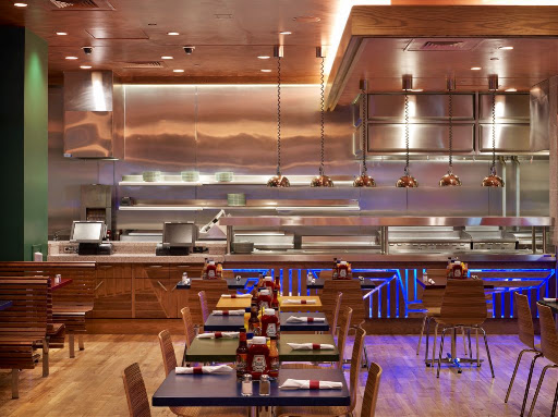 The primary colors and open kitchen of Burgers and More create a casual and family friendly environment.