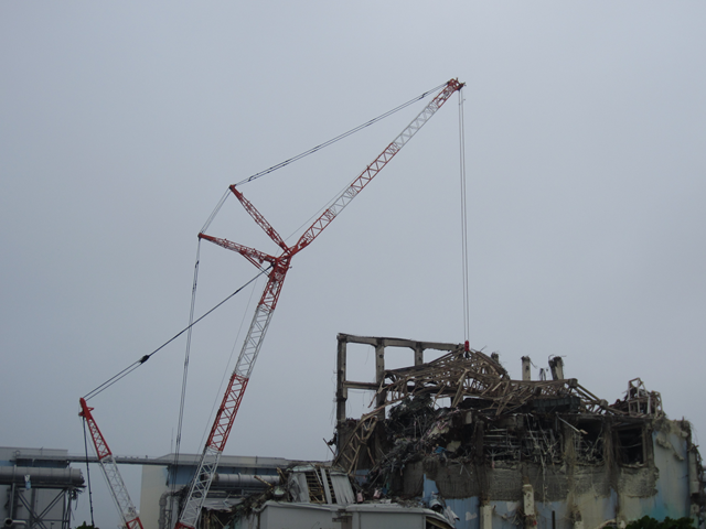 A crane is used to sample dust at the Fukushima Daiichi Nuclear Power Station Unit 3, 24 August 2011. TEPCO
