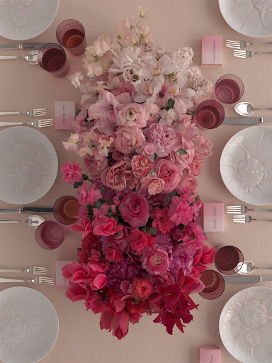 Different shades of red and pink flowers make up this arrangement. (Martha Stewart Weddings)