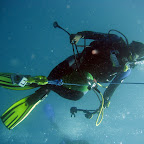 Diveguide Nour riding the bottle
