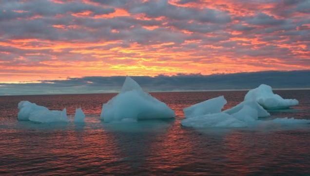 In this September 2006 file photo, ice chunks float in the Arctic Ocean as the sun sets near Barrow, Alaska. Photo: AP