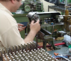 Hallmarking the silver tubes. Hallmarking the silver tubes.
