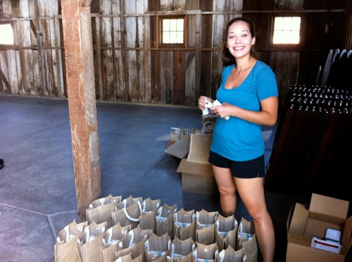 Alyssa readies the welcome bags.