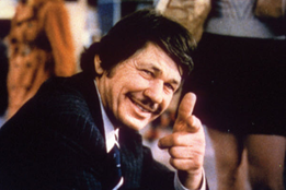 c0 Charles Bronson in the last scene from the first Death Wish movie. He's just arrived in a new town and is sending a message to the audience that he will continue his vigilante justice crusade. I went to a downtown Erie book store and bought a used paperback of Death Wish for 25 cents before the movie came to TV. That's how I consumed most movies in those days - in book form - since we weren't allowed to go to the theater, with rare exceptions.