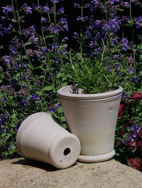 Buy a nice pot and plant some flowers or a small evergreen for your neighbors to put next to their front door. (benwolffpottery.com) Buy a nice pot and plant some flowers or a small evergreen for your neighbors to put next to their front door. (benwolffpottery.com)