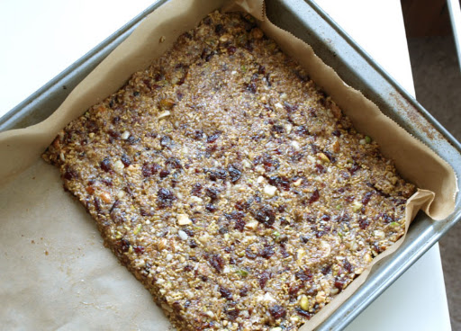 Press mixture into parchment-lined pan and bake for about 10 minutes.