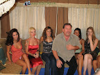 Who let the idiot in the shot, the girl in the red is not amused at him farting