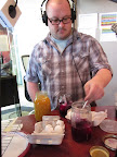 Chris placed hard boiled eggs into every jar.
