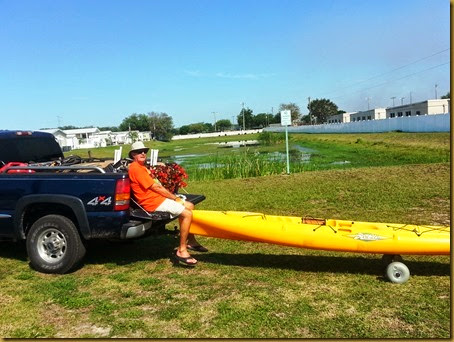 Vic wheeling his kayak while riding the tailgate vic wheeling kayak2 from tailgate