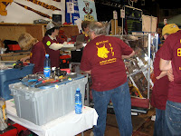 Students rushing to fix the robot between matches