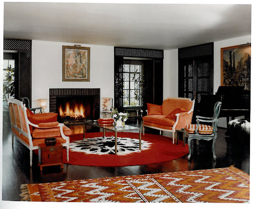 The drawing room is one of my favorite images in the book. I love the use of mahogany Moroccan grillwork at the windows and the black, white and coral color scheme - a Duquette signature.