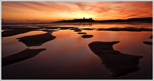 Dawn over Dunstanburgh. Neil Maughan
