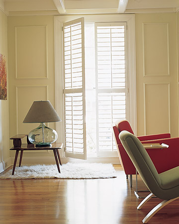 Floor-to-ceiling Plantation shutters add even mimic the wall molding in the room. Plantation shutters have louver blades that are wider than the typical shutter. (Martha Stewart Living) Floor-to-ceiling Plantation shutters add even mimic the wall molding in the room. Plantation shutters have louver blades that are wider than the typical shutter. (Martha Stewart Living)
