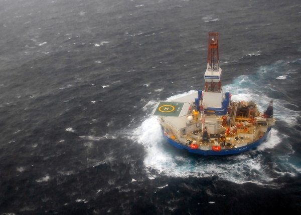 The Kulluk drill barge as it was being towed Sunday south of Kodiak Island in Alaska, 30 December 2012. Heavt seas forced crew members to disconnect the rig from its last remaining tow line and the vessel went aground on a small island south of Kodiak on 1 January 2012. U.S. Coast Guard