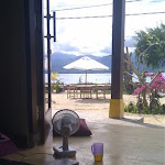 My office in a morning, I have my cushion, my fan, a book and a drink, plus the sea view and a smug grin ;)