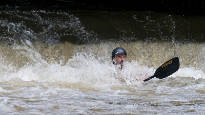 Chris going down in the whitewater.