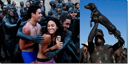Mud-covered revelers hug tourists, and a man holds up his dog during the "Bloco da Lama," or "Mud Block" carnival parade in Parati. (Felipe Dana/Associated Press)