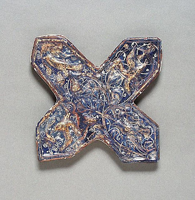 Cross Tile | Origin: Iran | Period: late 13th century | Collection: Shinji Shumeikai Acquisition Fund (AC1996.115.5) | Type: Ceramic; Architectural element, Fritware, molded, overglaze painted and gilded, lajvardina, Maximum height: 9 3/4 in. (24.8 cm)