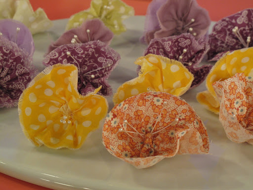 The fabric flowers have pretty pearl-tipped stamens.