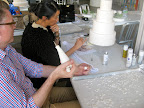 Michael and Katie collaborating on the design of the candy necklace that drapes around the cake.