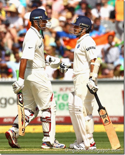 Rahul Dravid and Sachin Tendulkar of India celebrate a four during day two of the First Test match between Australia and India at Melbourne Cricket Ground