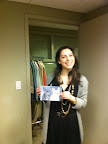 In fact, here she is: Show assistant Allie Wyman poses with the painting that Daily Wag reader Delia sent me to give to Martha.