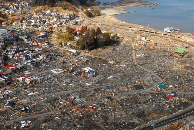 An aerial view of damage to Sukuiso, Japan, a week after the earthquake and subsequent tsunami devastated the area in March, 2011. Dylan McCord. U.S. Navy