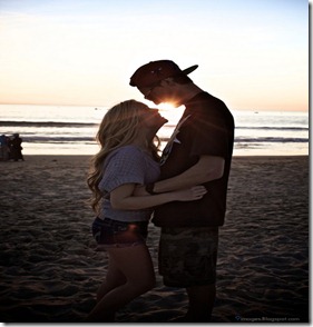 Hug-blonde-couple-beach-sunset-shorts-lovers