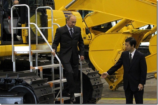 YAROSLAVL, RUSSIA - JUNE 18:  Russian Prime Minister Vladimir Putin (L) is guided by Yasuhisa Tsukamoto, Director General of the Komatsu Company in Russia, while visiting the KMR plant, a new assembly plant of Komatsu Manufacturing, June 18, 2010 in Yaroslavl, Russia. KMR is Komatsu's first assembly plant in Russia for construction and mining equipment.  (Photo by Sasha Mordovets/Getty Images)