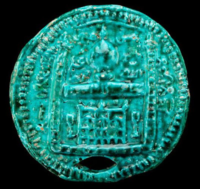 Beehive cover | Origin:  Iran | Period: 19th-20th century | Details:  Among some of the more unusual ceramic objects from Islamic Iran are beehive covers, some of which date back to at least the seventeenth century. Beekeeping was widely practiced throughout the Islamic world and because bees are singled out in the Koran, Islam's holy text, they enjoy particular status among other animals and insects. The designs on the two covers on view are intended as protective and auspicious symbols and are characteristic of the more vernacular ceramic tradition that has existed in the Islamic Near East for centuries. | Type: Stone-paste with glaze | Size: H: 2.7  W: 21.5   D: 21.5  cm | Museum Code: S1997.123 | Photograph and description taken from Freer and the Sackler (Smithsonian) Museums.