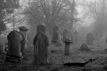 c0 A foggy old grave yard.
