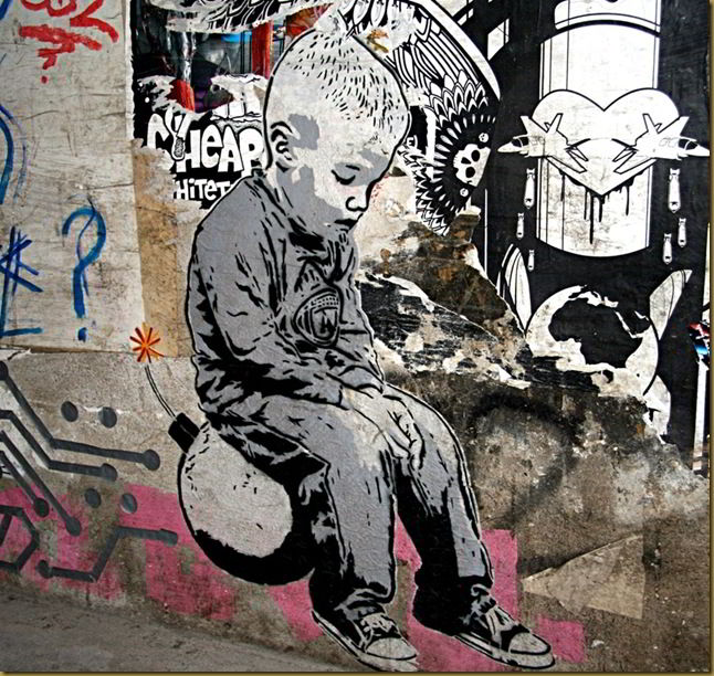 Boy on bomb, street art, Berlin, Germany